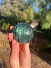 Load image into Gallery viewer, Blue Green Rainbow Filled Fluorite Sphere