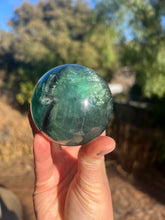 Load image into Gallery viewer, Blue Green Rainbow Filled Fluorite Sphere