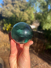 Load image into Gallery viewer, Blue Green Rainbow Filled Fluorite Sphere